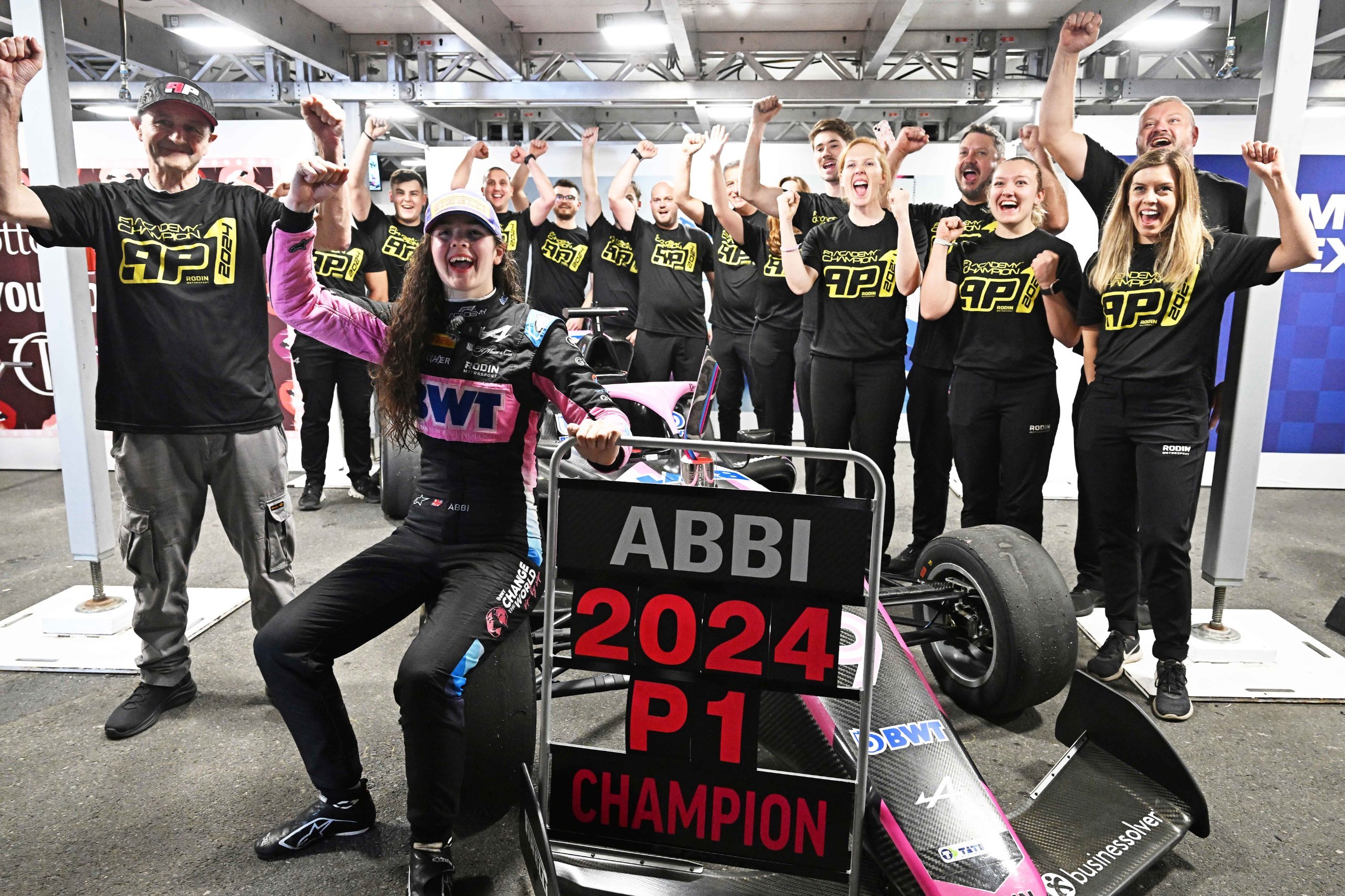 Abbi celebrating the 2024 F1 Academy title with her Rodin team